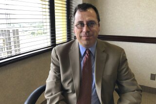 In this May 8, 2019, file photo, Lee Francis Cissna, director of U.S. Citizenship and Immigration Services, sits for a photo in Laguna Niguel, Calif. President Donald Trump has asked Cisna to resign, leaving yet another vacancy within the Department of Homeland Security. Cissna told staff on Friday, May 24, that his last day would be June 1 (AP Photo/Amy Taxin, File)
