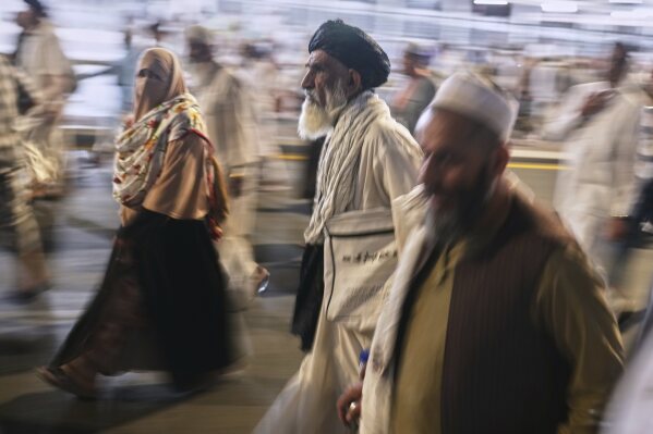 Muslim pilgrims leave the evening prayers outside the Grand Mosque, during the annual hajj pilgrimage in Mecca, Saudi Arabia, Monday, June 2, 2025. (AP Photo/Amr Nabi)