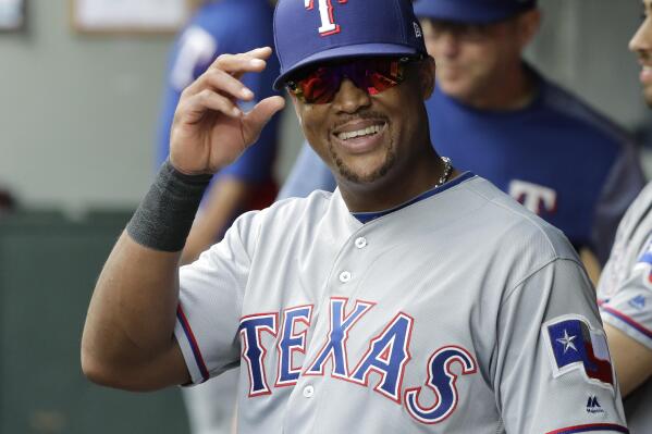 FILE - Texas Rangers' Adrian Beltre smiles in the dugout during the fifth inning of a baseball game against the Seattle Mariners after he was replaced by Jurickson Profar at third base, Sunday, Sept. 30, 2018, in Seattle. (AP Photo/Ted S. Warren, File)