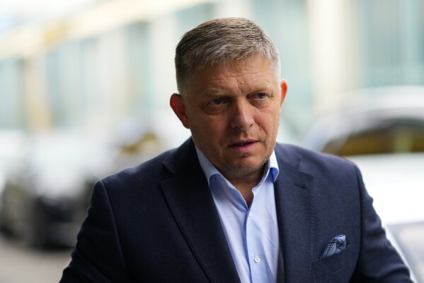 FILE - Chairman of SMER-Social Democracy party Robert Fico arrives at his party's headquarters in Bratislava, Slovakia, Sunday, Oct. 1, 2023 the day after an early parliamentary election. On Wednesday Oct. 11, 2023, Fico and his winning party in Slovakia's last month parliamentary election signed a memorandum with two other parties to form a new coalition government. (AP Photo/Petr David Josek, File)