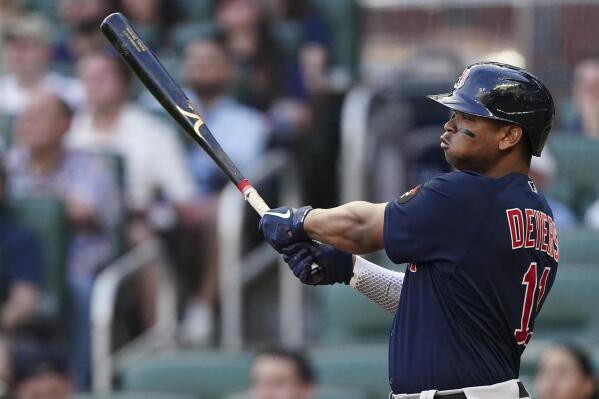 Boston Red Sox' Rafael Devers (11) is pushed through the dugout in