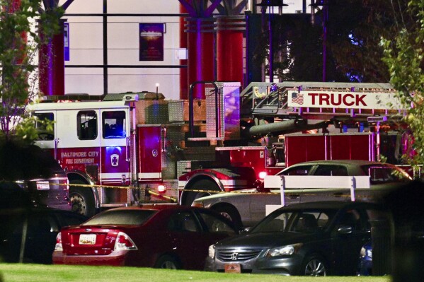 A Baltimore City Fire Department truck stages at Morgan State University during a shooting on the campus Tuesday, Oct. 3, 2023, in Baltimore. (Jerry Jackson/The Baltimore Sun via AP)