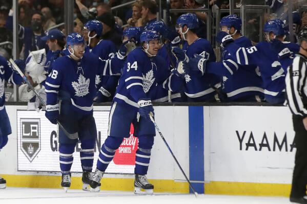 Toronto Maple Leafs center Auston Matthews (34) celebrates with teammates after scoring against the Los Angeles Kings during the second period of an NHL hockey game in Los Angeles, Wednesday, Nov. 24, 2021. (AP Photo/Alex Gallardo)