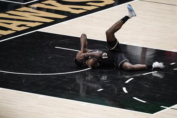 Atlanta Hawks' Clint Capela falls to the court after being hit during the second half against the Milwaukee Bucks in Game 4 of the NBA basketball Eastern Conference finals Tuesday, June 29, 2021, in Atlanta. (AP Photo/Brynn Anderson)