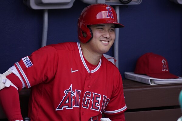 FILE - Los Angeles Angels' Shohei Ohtani smiles before a baseball game, Wednesday, Aug. 30, 2023, in Philadelphia. Shohei Ohtani is a favorite to win his second AL Most Valuable Player award, Thursday, Nov. 16, 2023, and is likely to speak publicly since tearing an elbow ligament on Aug. 9, an injury that required surgery and will keep him off the mound next year. (AP Photo/Matt Slocum, File)