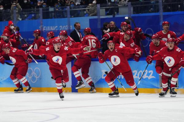 The Russian Olympic Committee celebrates the winning goal during a shootout by Arseni Gritsyuk in a men's semifinal hockey game against Sweden at the 2022 Winter Olympics, Friday, Feb. 18, 2022, in Beijing. (AP Photo/Petr David Josek)