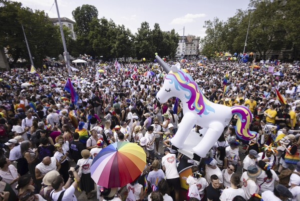 People take part in the Zurich Pride parade in Zurich, Switzerland, on Saturday, June 17, 2023. (Michael Buholzer/Keystone via AP)