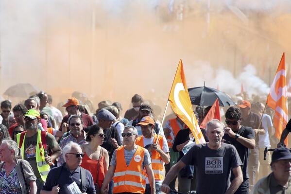 Protesters march during a rally in Bayonne, southwestern France, Tuesday, June 6, 2023. French unions are seeking to reignite resistance to President Emmanuel Macron's higher retirement age with what may be a final surge of nationwide protests and scattered strikes Tuesday. (AP Photo/Bob Edme)