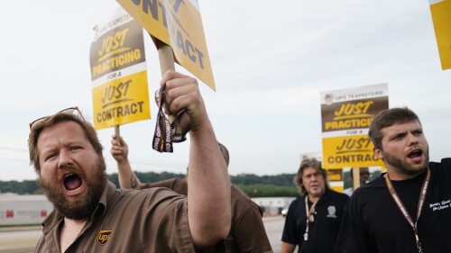 UPS teamsters and workers hold a rally, Friday, July 21, 2023, in Atlanta, as a national strike deadline nears. The Teamsters said Friday that they will resume contract negotiations with UPS, marking an end to a stalemate that began two weeks ago when both sides walked away from talks while blaming each other. (AP Photo/Brynn Anderson)