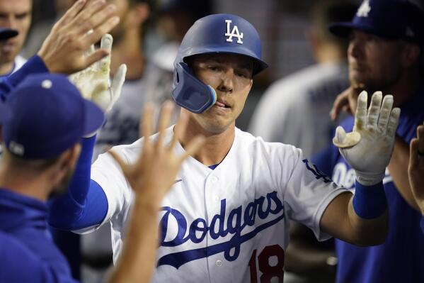 Los Angeles Dodgers' Jake Lamb (18) returns to the dugout after hitting a home run during the seventh inning of a baseball game against the Chicago Cubs in Los Angeles, Saturday, July 9, 2022. (AP Photo/Ashley Landis)
