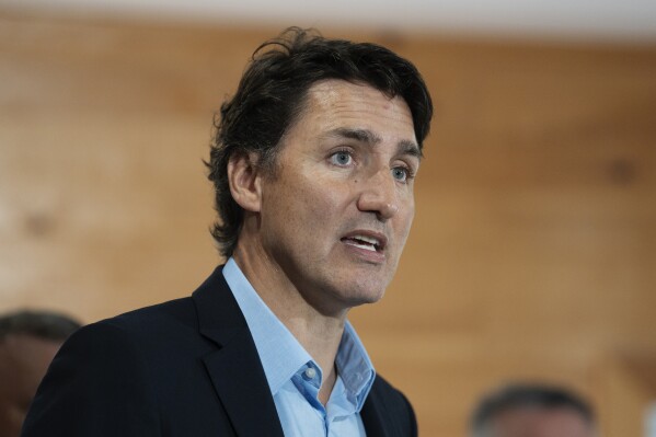 Canadian Prime Minister Justin Trudeau speaks to reporters following an announcement at the Island Montessori Academy in Cornwall, Prince Edward Island, Monday, Aug. 21, 2023. (Darren Calabrese/The Canadian Press via AP)