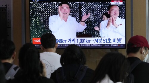 A TV screen shows an image of North Korean leader Kim Jong Un, left, during a news program, at the Seoul Railway Station in Seoul, South Korea, Thursday, July 13, 2023. Kim vowed to further bolster his country's nuclear fighting capabilities as he supervised the second test-flight of a new intercontinental ballistic missile designed to strike the mainland U.S., state media reported Thursday. (AP Photo/Ahn Young-joon)