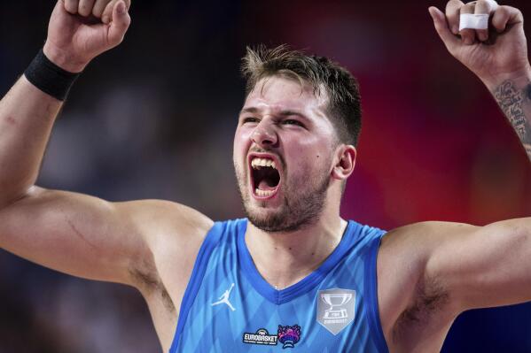 Slovenia's Luka Doncic reacts during the Eurobasket group B basketball match between France and Slovenia in Cologne, Germany, Wednesday Sept. 7, 2022. (Marius Becker/dpa via AP)