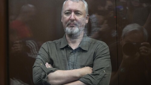 Igor Girkin also know as Igor Strelkov, the former military chief for Russia-backed separatists in eastern Ukraine sits in a glass cage in a courtroom at the Moscow's Meshchansky District Court in Moscow, Russia, Friday, July 21, 2023. A prominent Russian hard-line nationalist who accused President Vladimir Putin of weakness and indecision in Ukraine was detained Friday on charges of extremism, a signal the Kremlin has toughened its approach with hawkish critics after last month's abortive rebellion by the Wagner mercenary company. (AP Photo/Alexander Zemlianichenko, Pool)