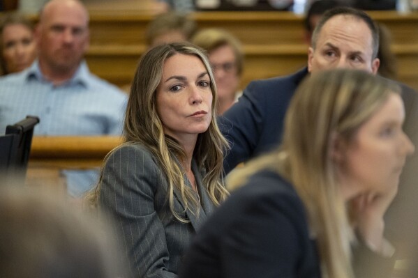 Karen Read sits with her legal team team in court, Thursday, May 2, 2024, in Dedham, Mass. Read, 44, is accused of running into her Boston police officer boyfriend with her SUV in the middle of a nor'easter and leaving him for dead after a night of heavy drinking. (David McGlynn/New York Post via AP, Pool)