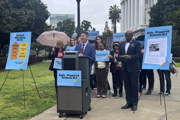 Democratic Assemblymember Chris Ward speaks at a news conference in Sacramento, Calif., on Tuesday, March 12, 2024. Assemblymember Ward has introduced a legislation that would create statewide standards for school shooting drills and ban fake gunfire during these drills. (AP Photo/Trân Nguyễn)