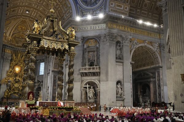Cardinals, with white mitre hats, attend a final Mass inside St. Peter's Basilica, before the conclave to elect a new pope, at the Vatican, Wednesday, May 7, 2025. (AP Photo/Gregorio Borgia)