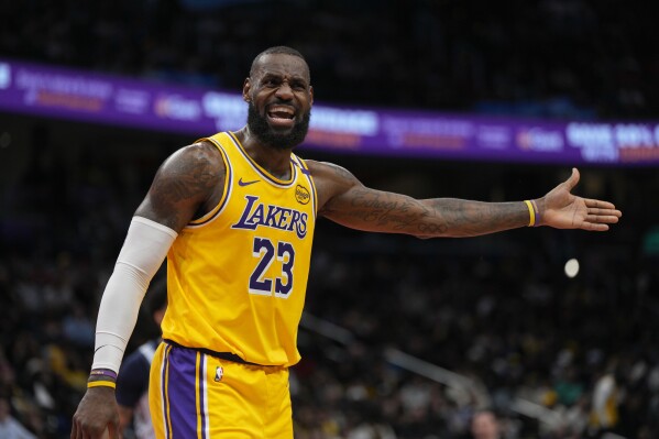 Los Angeles Lakers forward LeBron James reacts after a foul call during the first half of an NBA basketball game against the Washington Wizards, Thursday, Jan. 30, 2025, in Washington. (AP Photo/Jess Rapfogel)