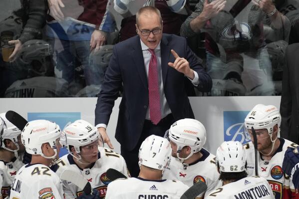 Florida Panthers coach Paul Maurice talks to players during the third period of the team's NHL hockey game against the Colorado Avalanche on Tuesday, Jan. 10, 2023, in Denver. (AP Photo/David Zalubowski)