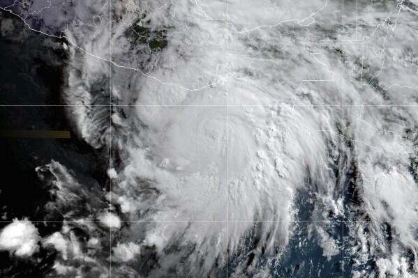 This satellite image provided by the National Oceanic and Atmospheric Administration (NOAA) shows Hurricane Erick approaching Mexico's Pacific coast, Wednesday morning, June 18, 2025. (NOAA via AP)