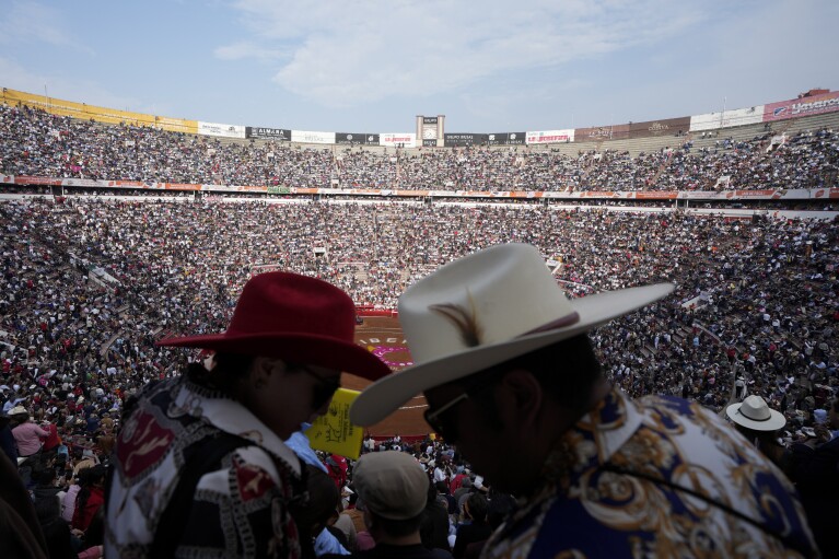 Spectators wait for a bullfight at the Plaza Mexico, in Mexico City, Sunday, Jan.  28, 2024. (AP Photo/Fernando Llano)