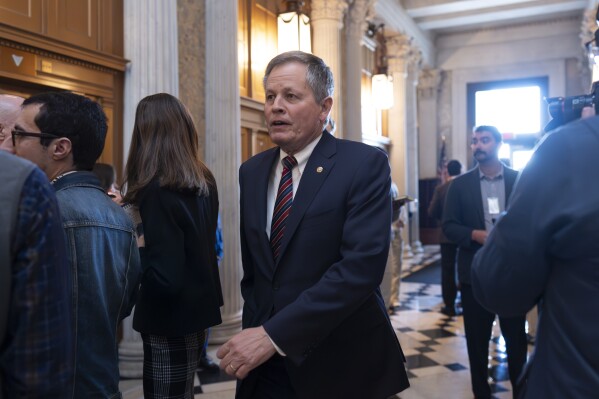 FILE - U.S. Sen. Steve Daines, R-Mont., arrives as the Senate prepares to advance the $95 billion aid package for Ukraine, Israel and Taiwan passed by the House, April 23, 2024, at the Capitol in Washington. Officials said Wednesday, May 29, that Daines blocked a Biden administration judicial nominee who would have been the state's first Native American federal judge. (AP Photo/J. Scott Applewhite, File)