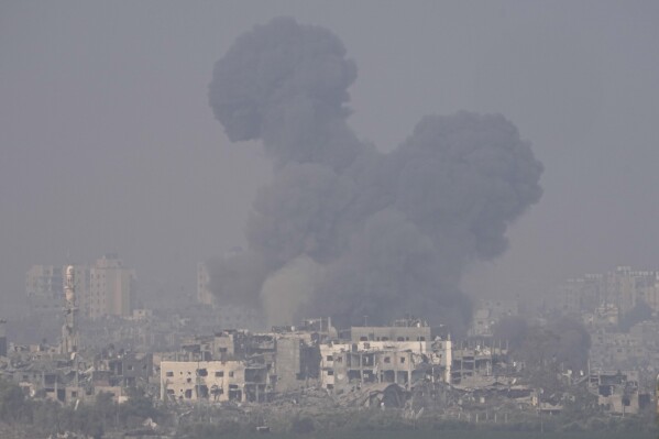 Smoke rises following an Israeli airstrike in the Gaza Strip, as seen from southern Israel, Saturday, Oct. 28, 2023. (AP Photo/Ohad Zwigenberg)