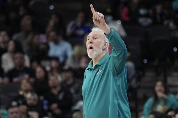San Antonio Spurs coach Gregg Popovich signals to players during the first half of the team's NBA basketball game against the Detroit Pistons in San Antonio, Friday, Jan. 6, 2023. (AP Photo/Eric Gay)