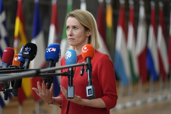 Estonia's Prime Minister Kaja Kallas speaks with the media as she arrives for an EU summit at the European Council building in Brussels, Friday, Oct. 27, 2023. European Union leaders conclude a second day of meetings on Friday in which they will discuss, among other issues, migration. (AP Photo/Virginia Mayo)