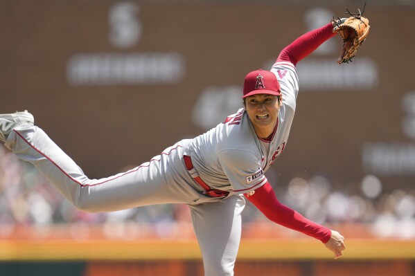 Los Angeles Angels pitcher Shohei Ohtani throws against the Detroit Tigers in the fourth inning during the first baseball game of a doubleheader, Thursday, July 27, 2023, in Detroit. (AP Photo/Paul Sancya)