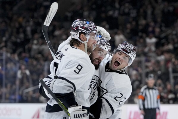 Los Angeles Kings defenseman Drew Doughty, center, celebrates his goal against the Anaheim Ducks with right wing Adrian Kempe, left, and left wing Kevin Fiala during the second period of an NHL hockey game Saturday, Feb. 24, 2024, in Los Angeles. (AP Photo/Ryan Sun)