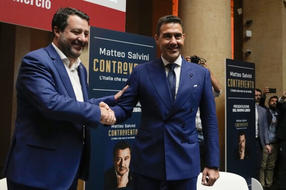 The League leader Matteo Salvini, left, arrives to his book presentation flanked by General Roberto Vannacci, one of the League candidates at the next European Parliament election, in Rome, Tuesday, April 30, 2024. (AP Photo/Alessandra Tarantino)