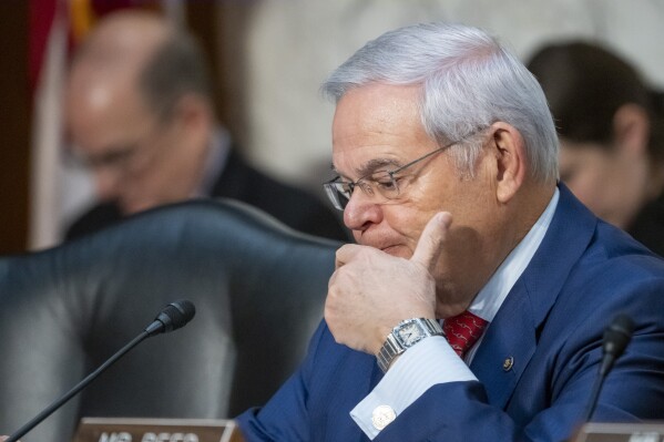 FILE - Sen. Bob Menendez, D-N.J., waits to speak during a Senate Banking, Housing, and Urban Affairs Committee oversight hearing, Dec. 6, 2023, in Washington. A federal judge on Monday, March 4, 2024, rejected Menendez’s claims that search warrants that led to corruption charges and the discovery of gold bars and cash at his New Jersey home were unconstitutional. (AP Photo/Alex Brandon, File)