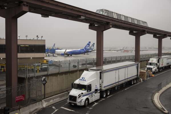 A general view shows an AirTran moves past tarmac at Newark Liberty International Airport, Monday, June 9, 2025, in Newark, N.J. (AP Photo/Yuki Iwamura)