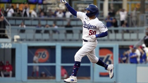 Los Angeles Dodgers' Mookie Betts rounds second after hitting a solo home run during the third inning of a baseball game against the Los Angeles Angels Friday, July 7, 2023, in Los Angeles. (AP Photo/Mark J. Terrill)