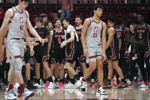 Utah players celebrate after an NCAA college basketball game against Stanford in Stanford, Calif., Thursday, Feb. 17, 2022. (AP Photo/Darren Yamashita)
