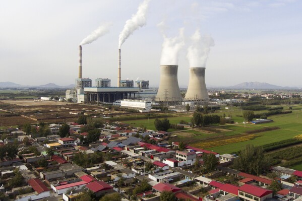 Guohua Power Station, a coal-fired power plant, operates in Dingzhou, Baoding, in the northern China's Hebei province, Friday, Nov. 10, 2023. (AP Photo/Ng Han Guan)