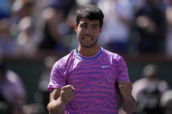 Carlos Alcaraz, of Spain, celebrates after defeating Fabian Marozsan, of Hungary, at the BNP Paribas Open tennis tournament Tuesday, March 12, 2024, in Indian Wells, Calif. (AP Photo/Mark J. Terrill)
