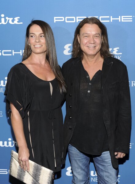 FILE - Musician Eddie Van Halen and his wife Janie Liszewski attend the Esquire 80th Anniversary and Network Launch Event in New York on Sept. 17, 2013. Van Halen, who had battled cancer, died Tuesday, Oct. 6, 2020. He was 65. (Photo by Evan Agostini/Invision/AP, File)