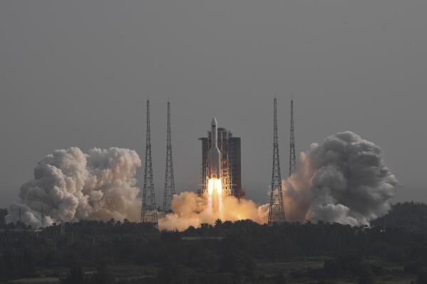 FILE - In this photo released by Xinhua News Agency, the Long March-5B Y4 carrier rocket carrying the space lab module Mengtian blasts off from the Wenchang Satellite Launch Center in south China's Hainan Province on Oct. 31, 2022. Philippine officials said Wednesday, Nov. 9, 2022, suspected debris from a recent Chinese rocket launch has been found at sea off two provinces and they were pressing efforts for Manila to ratify two U.N. treaties that allow people to seek compensation for damage or injury from space launches. (Hu Zhixuan/Xinhua via AP, File)