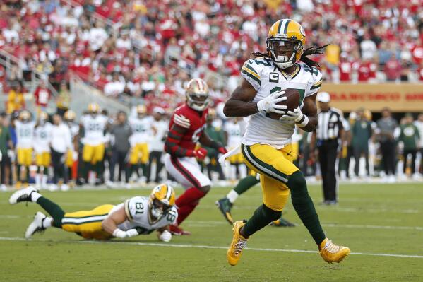 Green Bay Packers wide receiver Davante Adams catches a touchdown pass against the San Francisco 49ers during the first half of an NFL football game in Santa Clara, Calif., Sunday, Sept. 26, 2021. (AP Photo/Jed Jacobsohn)
