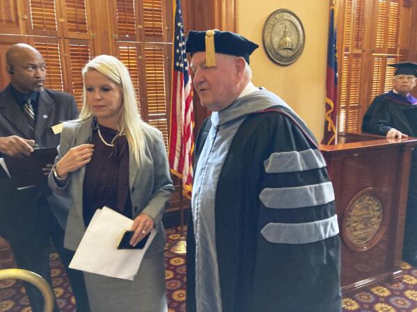 Sonny Perdue lines up for his formal installation as University System of Georgia chancellor on Friday, Sept. 9, 2022 at the state capitol in Atlanta. Perdue, who was Georgia's first modern Republican governor and later U.S. agriculture secretary, started leading the 340,000-student system in April. (AP Photo/Jeff Amy)