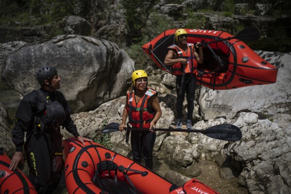 Tourists practice packrafting along the Verdon Gorge in southern France, Monday, June 19, 2023. (AP Photo/Daniel Cole)
