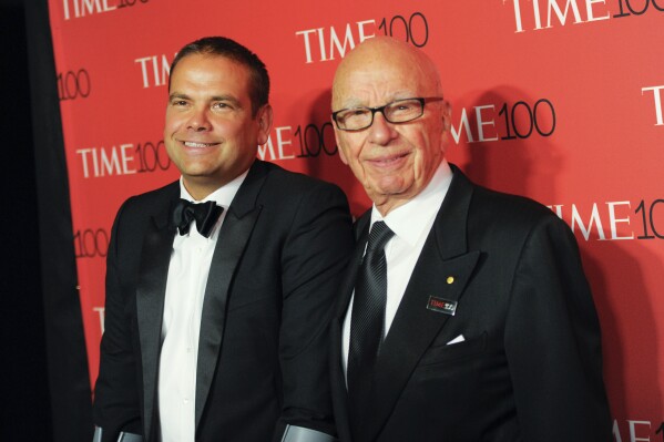 FILE - Lachlan Murdoch, left, and Rupert Murdoch attend the TIME 100 Gala in New York on April 21, 2015. Media magnate Rupert Murdoch is stepping down as chairman of News Corp. and Fox Corp., the companies that he built into forces over the last 50 years. He will become chairman emeritus of both corporations, the company announced on Thursday. His son, Lachlan, will control both companies. (Photo by Evan Agostini/Invision/AP, File)