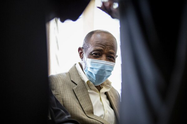 Paul Rusesabagina, who inspired the film "Hotel Rwanda" for saving people from genocide, appears at the Kicukiro Primary Court in the capital Kigali, Rwanda Monday, Sept. 14, 2020. Rusesabagina became famous for protecting more than 1,000 people as a hotel manager during Rwanda's 1994 genocide and was awarded the U.S. Presidential Medal of Freedom in 2005 but Rwandan authorities accused him of supporting the armed wing of his opposition political platform, which has claimed responsibility for deadly attacks inside Rwanda. (AP Photo)