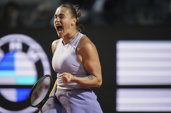 Aryna Sabalenka of Belarus reacts during a quarter-final tennis match against China's Qinwen Zheng at the Italian Open in Rome, Italy, Wednesday, May 14, 2025. (AP Photo/Alessandra Tarantino)