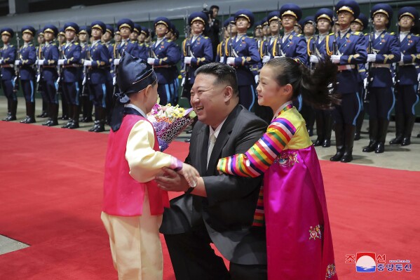 In this photo provided by the North Korean government, North Korea leader Kim Jong Un, center, arrives at Pyongyang station, North Korea Tuesday, Sept. 19, 2023, after a trip to Russia. Independent journalists were not given access to cover the event depicted in this image distributed by the North Korean government. The content of this image is as provided and cannot be independently verified. Korean language watermark on image as provided by source reads: 