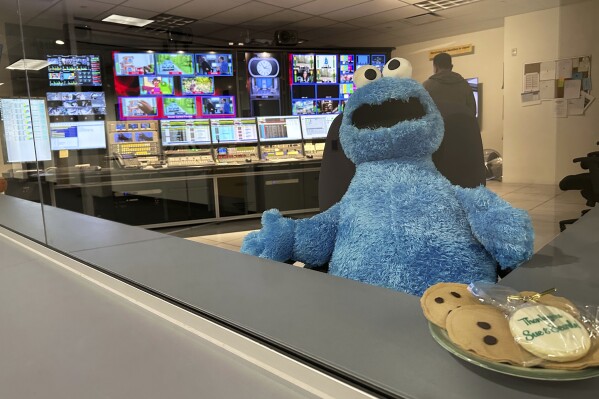 A stuffed Cookie Monster is seated in a control room at the Arizona PBS offices at the Walter Cronkite School of Journalism and Mass Communication in Phoenix, Friday, May 2, 2025. (AP Photo/Katie Oyan)