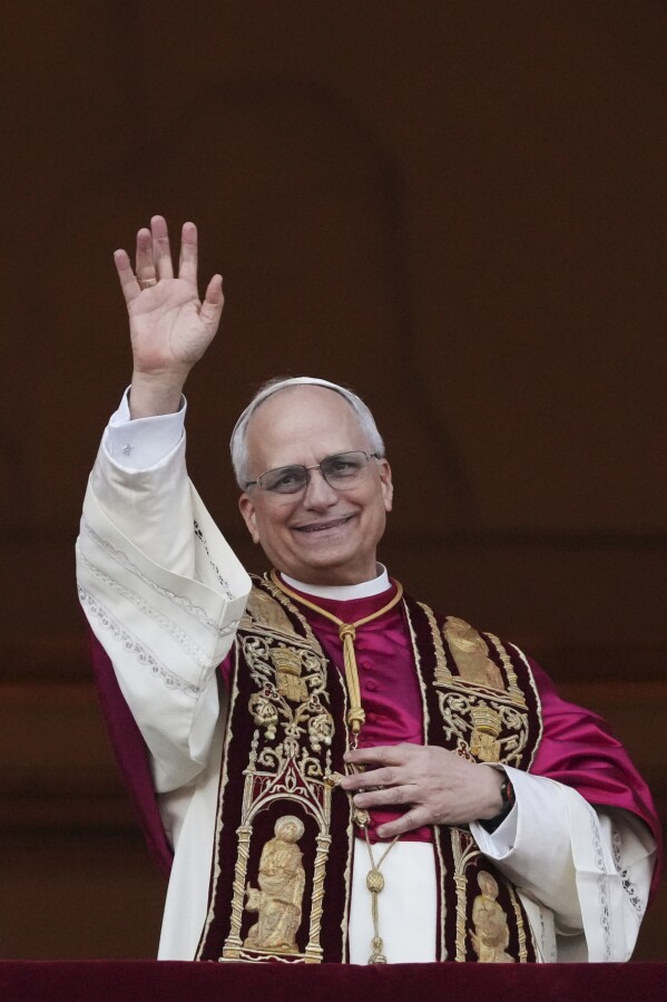 Newly elected Pope Leo XIV appears at the balcony of St. Peter's Basilica at the Vatican, Thursday, May 8, 2025. (AP Photo/Alessandra Tarantino)