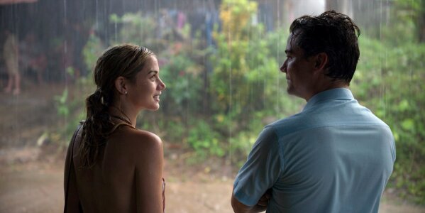 This image released by Netflix shows Ana de Armas, left, and Wagner Moura in a scene from "Sergio." (Netflix via AP)